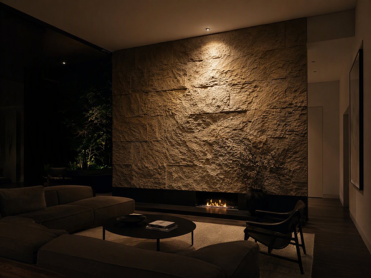 Accent lighting: a stone feature wall dramatically spotlit in an otherwise dim room
