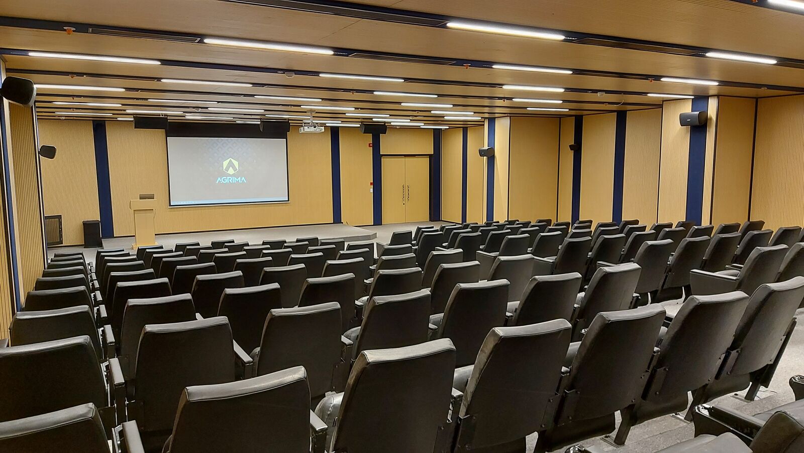 Balaji Wafers auditorium seating with presentation screen active