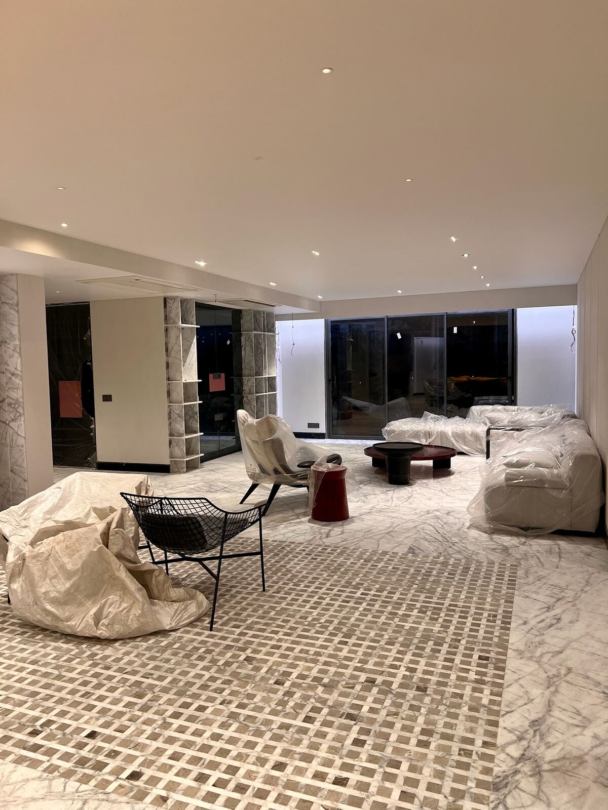 Emberlynn bedroom under fit-out with dark marble accent wall