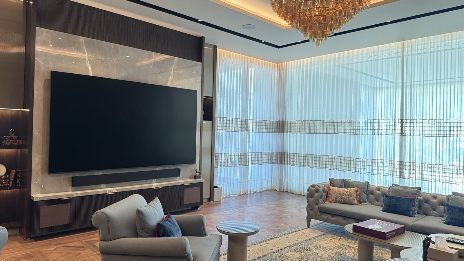 Media wall and seating with automated lighting at the Rohan Kataria residence